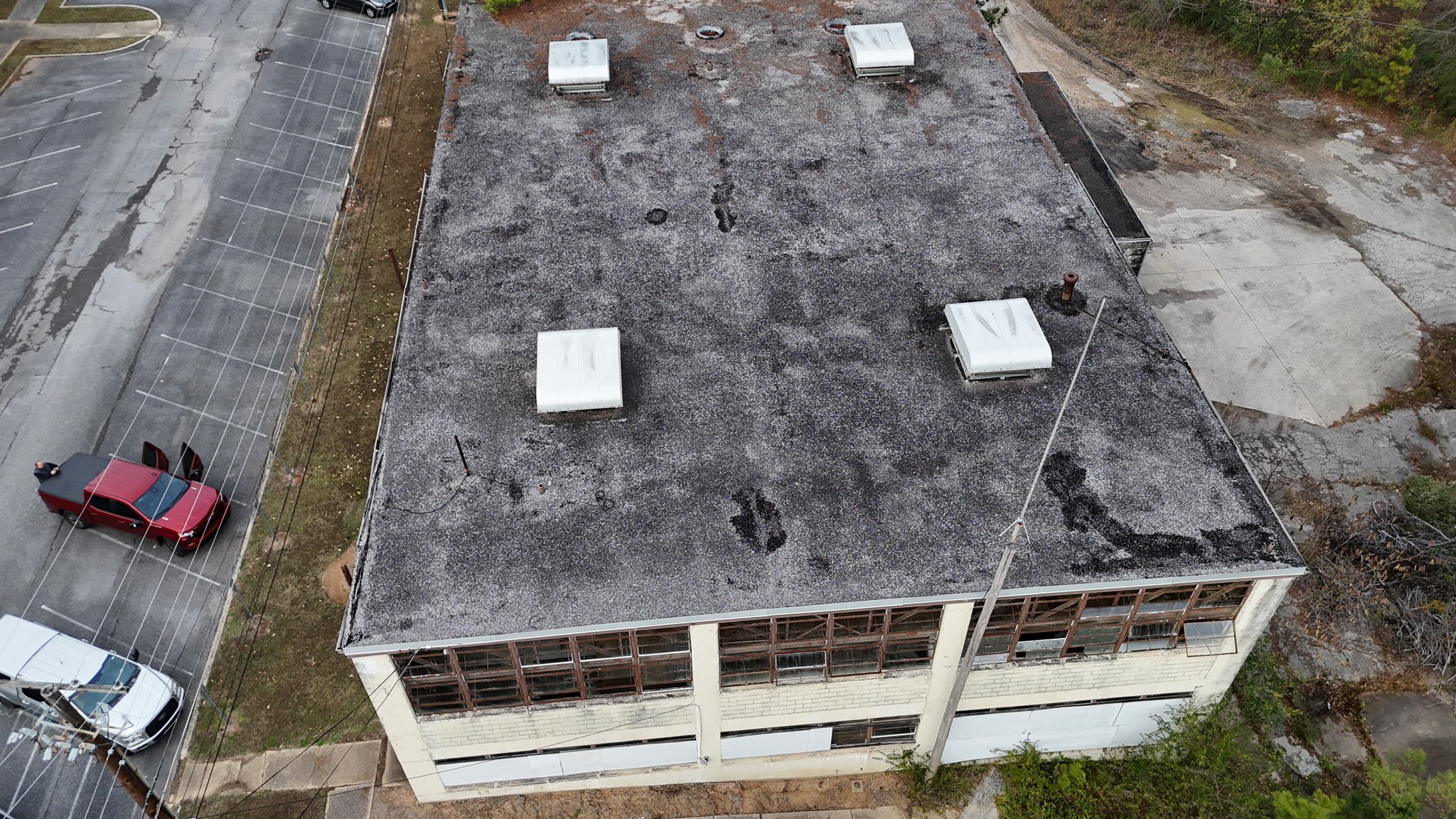 Duro-Last PVC commercial roof installation in progress on 9,600 sq ft warehouse in Anniston, Alabama