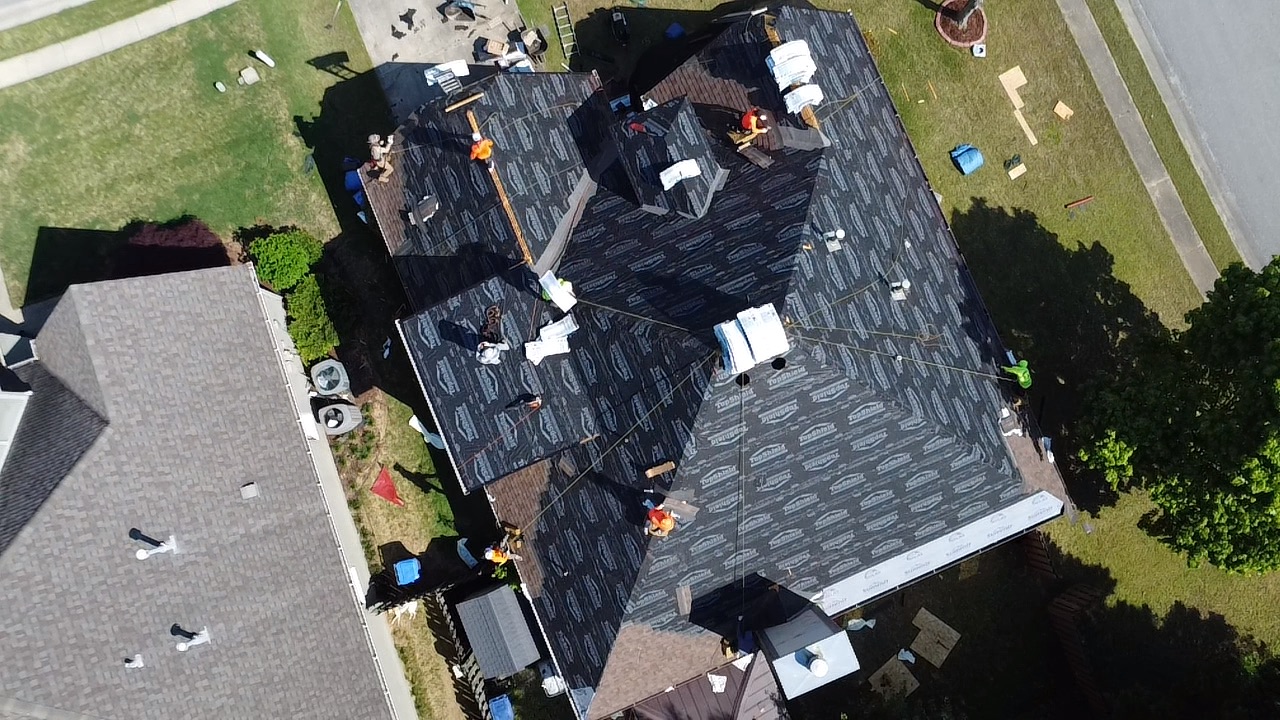 FCRS crew installing synthetic underlayment on Trussville roof replacement project